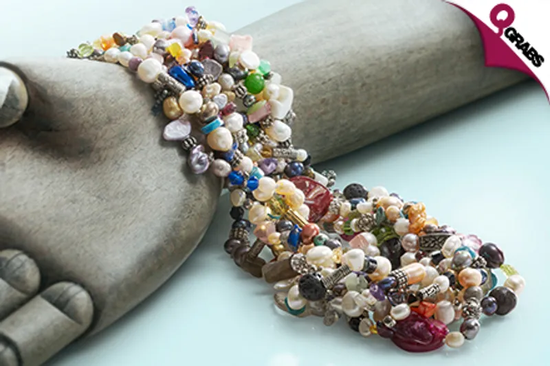 From QR89 Add a Unique Touch to Your Outfits with a Single OR Triple Strand Freshwater Pearl Charm Necklace! (Up to QR1540 Value)